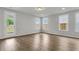 Bright living room with access to the yard and features hardwood floors at 319 Abercom Place Dr, Moncks Corner, SC 29461