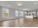 Open-concept living room, with natural lighting, and hardwood floors at 319 Abercom Place Dr, Moncks Corner, SC 29461