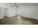 Spacious bedroom with a ceiling fan, large window, and wood-look flooring at 335 Macgregor Dr, Summerville, SC 29486