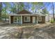 Charming single-story home with brown wood shingles, and a well-manicured front yard at 335 Macgregor Dr, Summerville, SC 29486