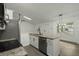 Bright kitchen featuring white cabinetry, a breakfast bar, and stainless steel appliances at 335 Macgregor Dr, Summerville, SC 29486