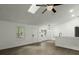 Open-concept living room with natural light, neutral colors, and vinyl flooring at 335 Macgregor Dr, Summerville, SC 29486