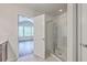 Bathroom featuring glass enclosed shower, and a partial view into the bedroom with windows at 3367 Eastman Dr, Mount Pleasant, SC 29466