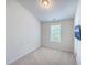 Carpeted bedroom with a window providing natural light and TV mounted on the wall at 3367 Eastman Dr, Mount Pleasant, SC 29466