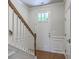 Inviting entryway featuring hardwood floors, traditional staircase, and a stylish white front door with glass panes at 3367 Eastman Dr, Mount Pleasant, SC 29466