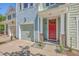 Beautiful townhome featuring a red front door, a garage, and a well-kept front yard at 3367 Eastman Dr, Mount Pleasant, SC 29466