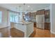 Open kitchen with granite island, stainless appliances, and abundant natural light at 3367 Eastman Dr, Mount Pleasant, SC 29466