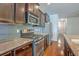 Modern kitchen featuring granite counters, stainless steel appliances, and dark wood cabinetry at 3367 Eastman Dr, Mount Pleasant, SC 29466
