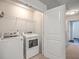 Laundry room with modern washer and dryer, wire shelving, and easy access to other areas at 3367 Eastman Dr, Mount Pleasant, SC 29466