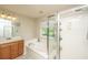 Well-lit bathroom featuring a soaking tub and a separate glass-enclosed shower at 3517 Claremont St, Mount Pleasant, SC 29466