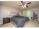 Serene bedroom with a ceiling fan and access to a private outdoor balcony at 3517 Claremont St, Mount Pleasant, SC 29466