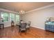 Bright dining room with wood floors, a chandelier, and a table that seats four at 3517 Claremont St, Mount Pleasant, SC 29466