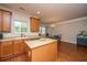 Warm kitchen with eat-in area, wooden cabinets, and hardwood floors at 3517 Claremont St, Mount Pleasant, SC 29466