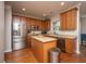 Updated kitchen features stainless steel appliances, center island, and wood cabinetry at 3517 Claremont St, Mount Pleasant, SC 29466
