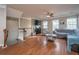 Hardwood floors, fan, and a TV add to this open concept living room at 3517 Claremont St, Mount Pleasant, SC 29466
