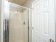 A bright and clean shower with glass door, adjacent to a white interior door at 3517 Claremont St, Mount Pleasant, SC 29466