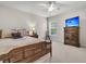 Bedroom featuring a ceiling fan, television, and a wooden bed with patterned pillows at 3537 Galaxy Rd, Ladson, SC 29456