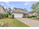 Attractive two-story home with a two-car garage, manicured lawn, and well-maintained landscaping at 3537 Galaxy Rd, Ladson, SC 29456