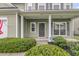 Charming front door framed by symmetrical windows and manicured bushes enhance the home's curb appeal at 3537 Galaxy Rd, Ladson, SC 29456