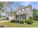 Charming two-story home featuring an attached garage, manicured lawn, and neatly trimmed landscaping at 3537 Galaxy Rd, Ladson, SC 29456