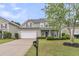 Charming two-story home with a well-manicured lawn and an attached two-car garage at 3537 Galaxy Rd, Ladson, SC 29456