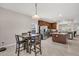 Bright kitchen adjacent to the dining area with wooden cabinets, stainless appliances, and kitchen island at 3537 Galaxy Rd, Ladson, SC 29456