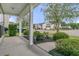 Covered front porch view highlighting meticulous landscaping and neighborhood street at 3537 Galaxy Rd, Ladson, SC 29456