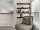 Cozy reading nook area with floating shelves and a window providing natural light at 3537 Galaxy Rd, Ladson, SC 29456
