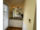 Vanity with wood floors, ample lighting, and a window with blinds at 36 Forde Row, Charleston, SC 29412