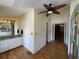 Bathroom with double vanity, wood floors, and a door leading to another room at 36 Forde Row, Charleston, SC 29412