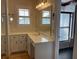 Bright bathroom with a tub, and a vanity with ample counter space at 36 Forde Row, Charleston, SC 29412