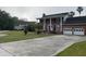 Traditional brick home boasting a spacious driveway and attached two-car garage at 36 Forde Row, Charleston, SC 29412