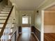 Inviting foyer with hardwood floors, staircase, and classic architectural details at 36 Forde Row, Charleston, SC 29412