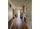 Charming foyer with hardwood floors, staircase, and an open view to the outside at 36 Forde Row, Charleston, SC 29412