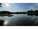 Beautiful lake view with a dock, clear skies, and calm waters, perfect for lakeside living at 36 Forde Row, Charleston, SC 29412