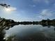 Scenic lake view reflecting the sky and surrounding trees, creating a serene and natural setting at 36 Forde Row, Charleston, SC 29412