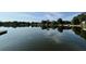 Serene lake view reflecting the sky and trees, offering a tranquil and picturesque setting at 36 Forde Row, Charleston, SC 29412