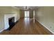 Bright living room with hardwood floors, fireplace, and view to the rear yard at 36 Forde Row, Charleston, SC 29412