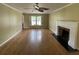 Spacious living room featuring hardwood floors, a cozy fireplace, and bright natural light at 36 Forde Row, Charleston, SC 29412