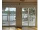 Beautiful backyard water view from the living room with sliding glass doors and wood deck at 36 Forde Row, Charleston, SC 29412
