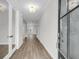 Bright entryway featuring hardwood floors, glass doors, and views to the living room and windows at 389 Wappoo Trace Ln, Summerville, SC 29486