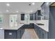 Kitchen with island, stainless steel appliances, and tile backsplash at 389 Wappoo Trace Ln, Summerville, SC 29486