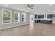 Bright living room with windows and open access to the kitchen at 389 Wappoo Trace Ln, Summerville, SC 29486