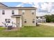 Green backyard of a townhome with an air conditioner at 394 Flyway Rd, Goose Creek, SC 29445