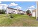 Townhome backyard with well maintained lawn and other neighborhood homes at 394 Flyway Rd, Goose Creek, SC 29445