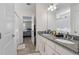 Bathroom with double sinks, granite countertop, and large mirror with view of bedroom at 394 Flyway Rd, Goose Creek, SC 29445