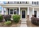 Charming townhome entrance with a brick pillar and dark door at 394 Flyway Rd, Goose Creek, SC 29445