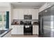 Well-equipped kitchen with stainless steel appliances, white cabinets, and stylish subway tile backsplash at 394 Flyway Rd, Goose Creek, SC 29445