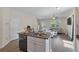 Modern kitchen open to the living area, featuring a granite island and stainless steel appliances at 394 Flyway Rd, Goose Creek, SC 29445