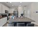 Spacious kitchen featuring a granite island with seating, stainless steel appliances, and ample cabinet space at 394 Flyway Rd, Goose Creek, SC 29445